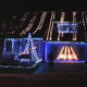 Illustration for article titled Guitar Hero Played On Side of House in Christmas Lights Invents New Class of Neighborhood Competition